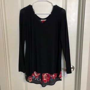 Black maternity dress with floral details.